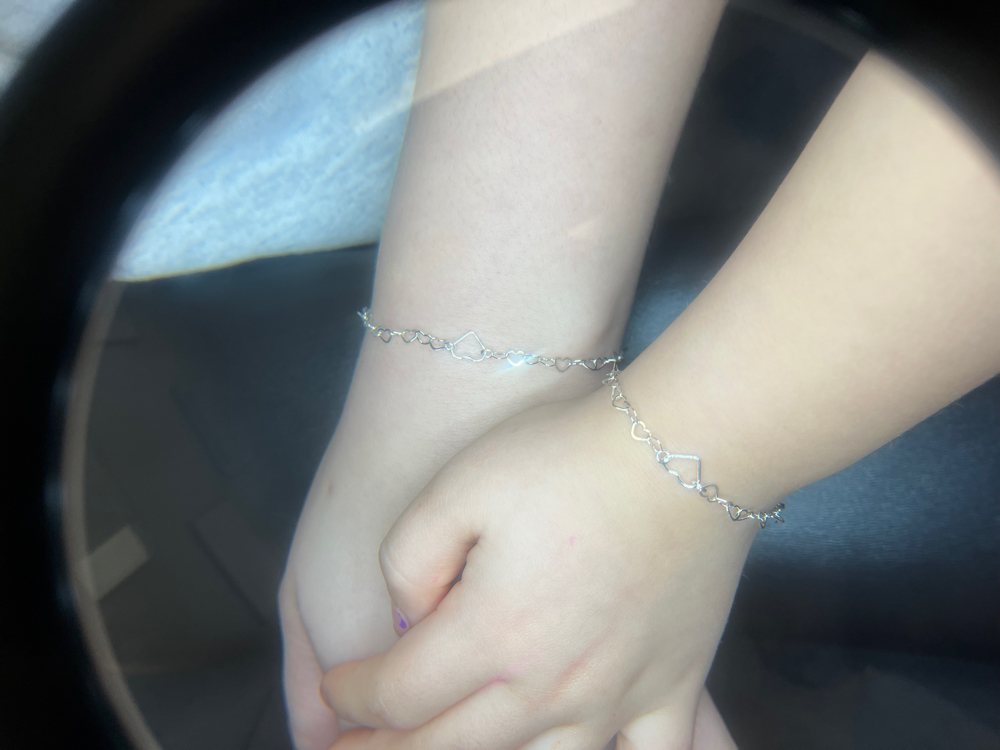 Matching permanent bracelets from a jewelry party at The Beauty Cocoon